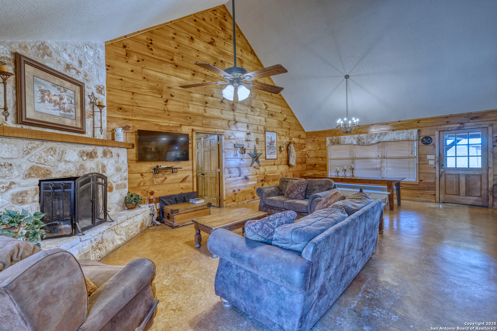 38 Mountain Laurel Lane Concan, TX 78838 - Photo 24 of 48 a living room with furniture and a fireplace