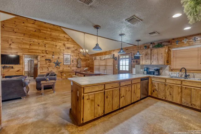 a kitchen with sink cabinets and window