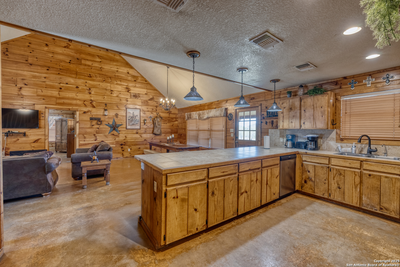 38 Mountain Laurel Lane Concan, TX 78838 - Photo 32 of 48 a kitchen with sink cabinets and window
