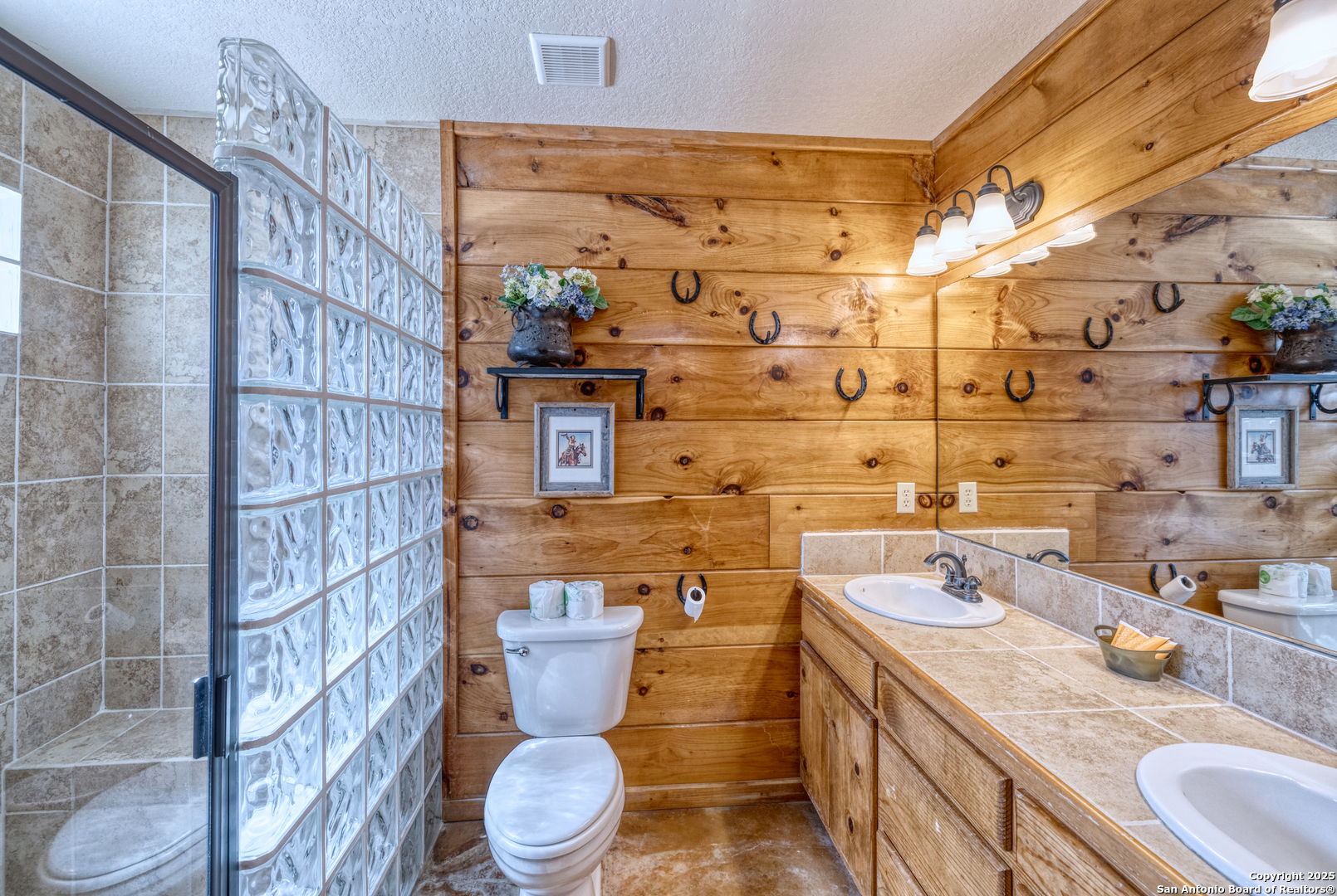 38 Mountain Laurel Lane Concan, TX 78838 - Photo 37 of 48 a bathroom with a sink toilet and shower
