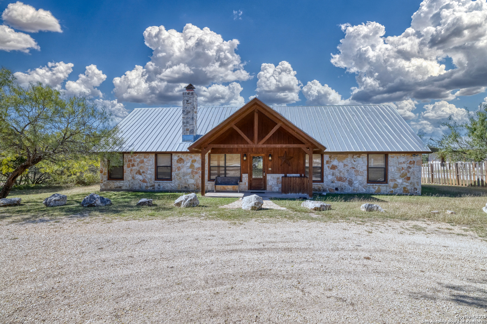 38 Mountain Laurel Lane Concan, TX 78838 - Photo 4 of 48 a view of a house with a yard
