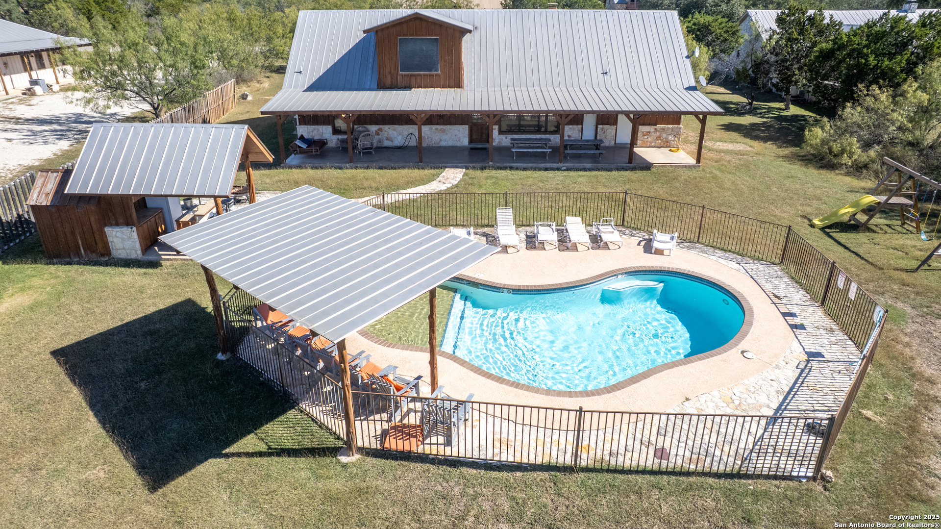 38 Mountain Laurel Lane Concan, TX 78838 - Photo 48 of 48 a view of a house with swimming pool and sitting area