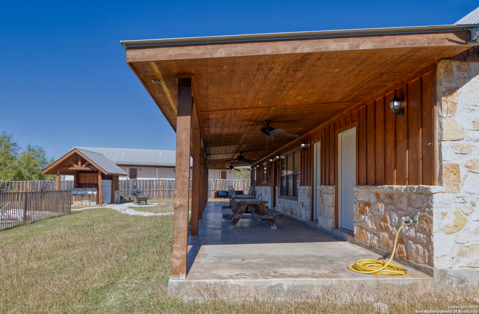 38 Mountain Laurel Lane Concan, TX 78838 - Photo 5 of 48 a view of a patio with a table and chairs