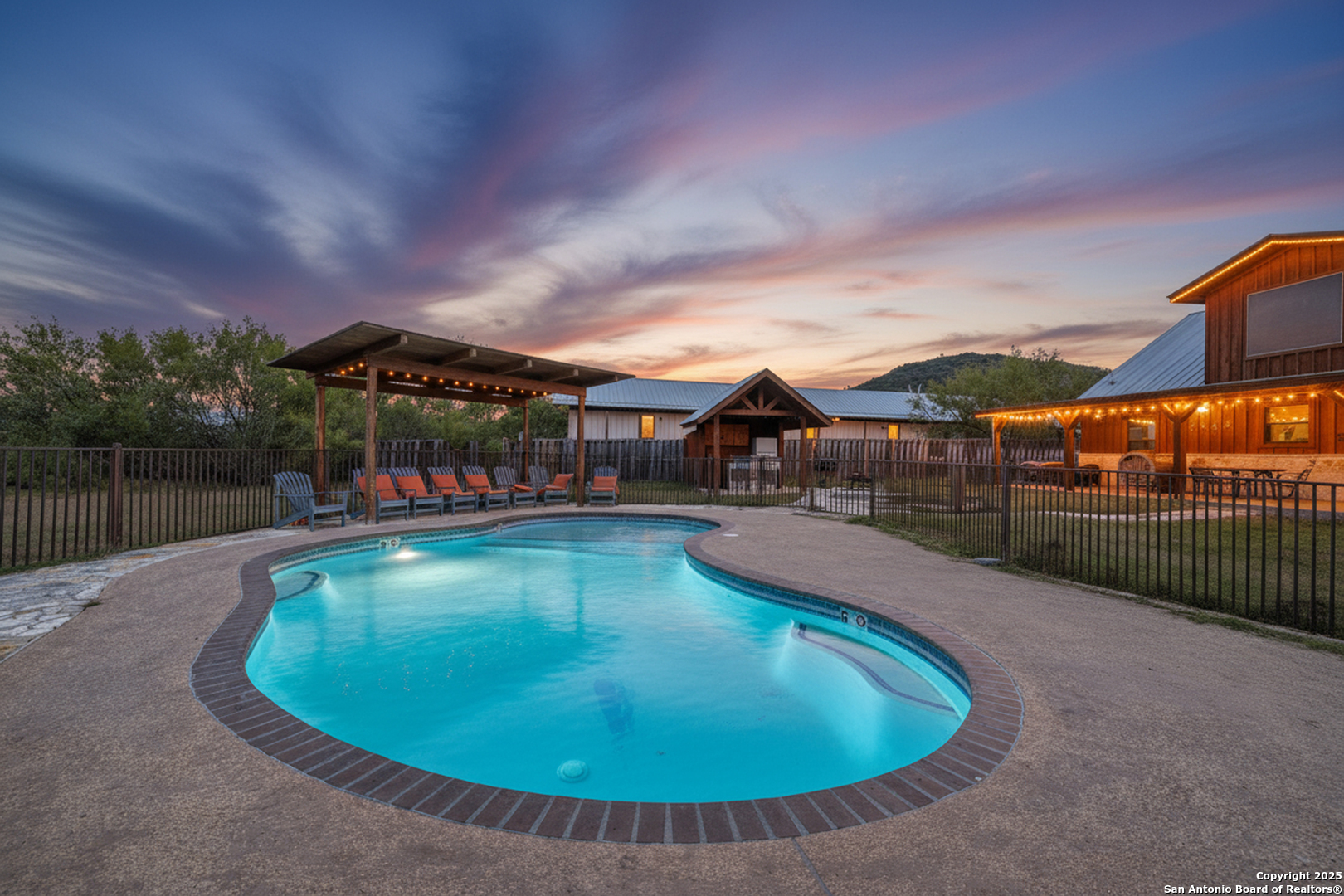 38 Mountain Laurel Lane Concan, TX 78838 - Photo 8 of 48 a view of a swimming pool with a patio