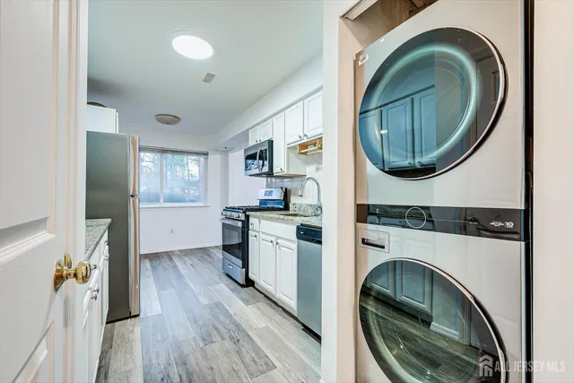 a kitchen with a washer and dryer