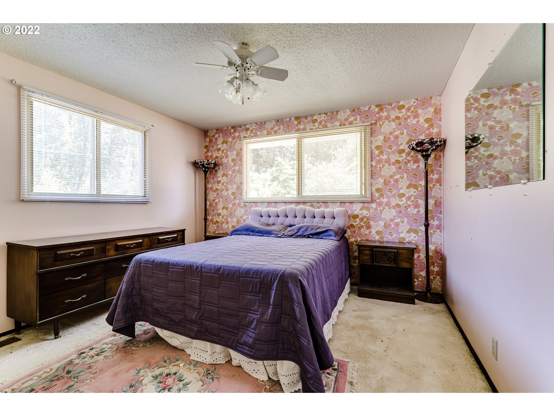 37833 Camp Creek Road Springfield, OR 97478 - Photo 12 of 32 a bedroom with a bed and a chandelier