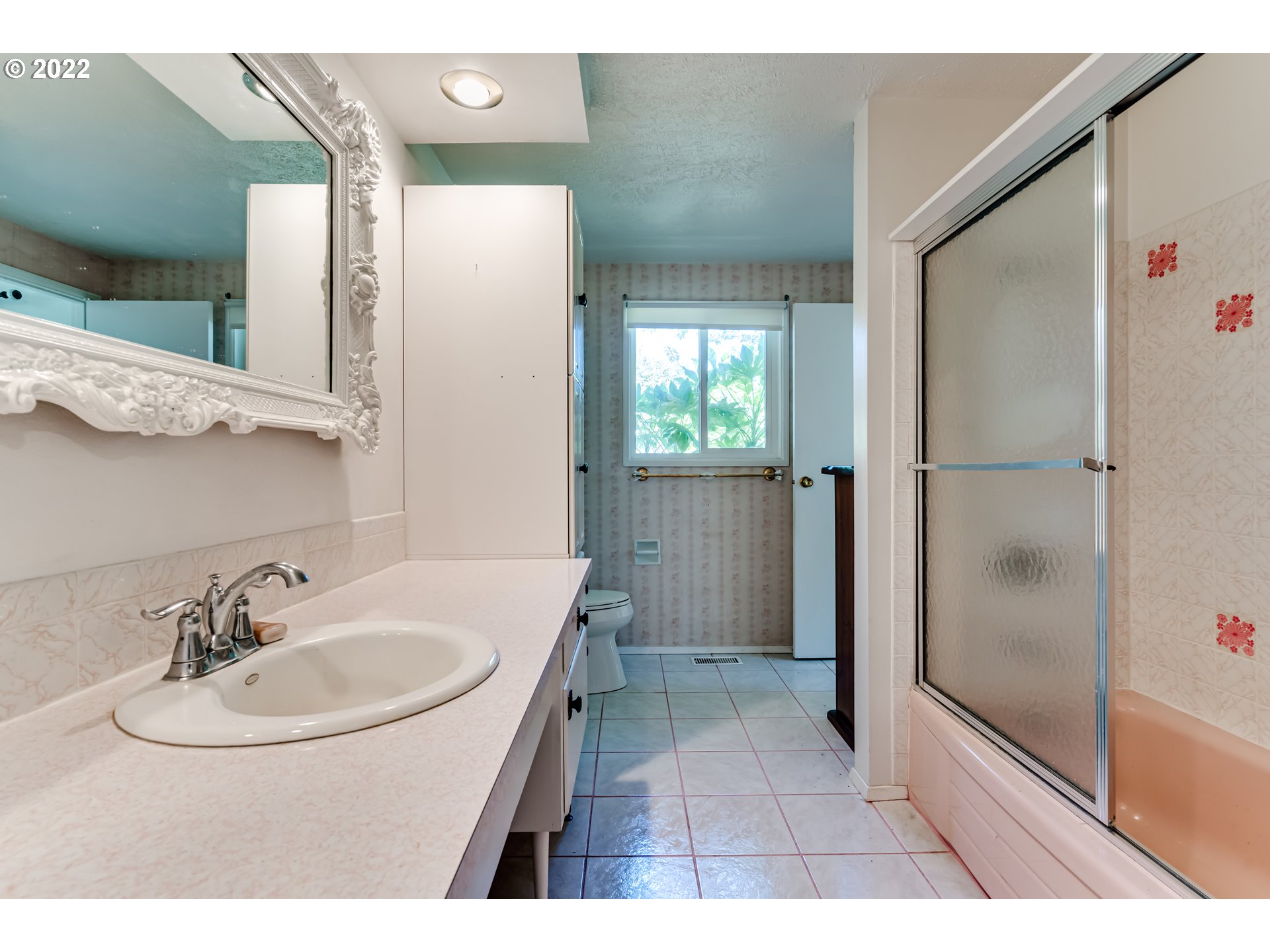 37833 Camp Creek Road Springfield, OR 97478 - Photo 13 of 32 a bathroom with a sink a mirror and a shower