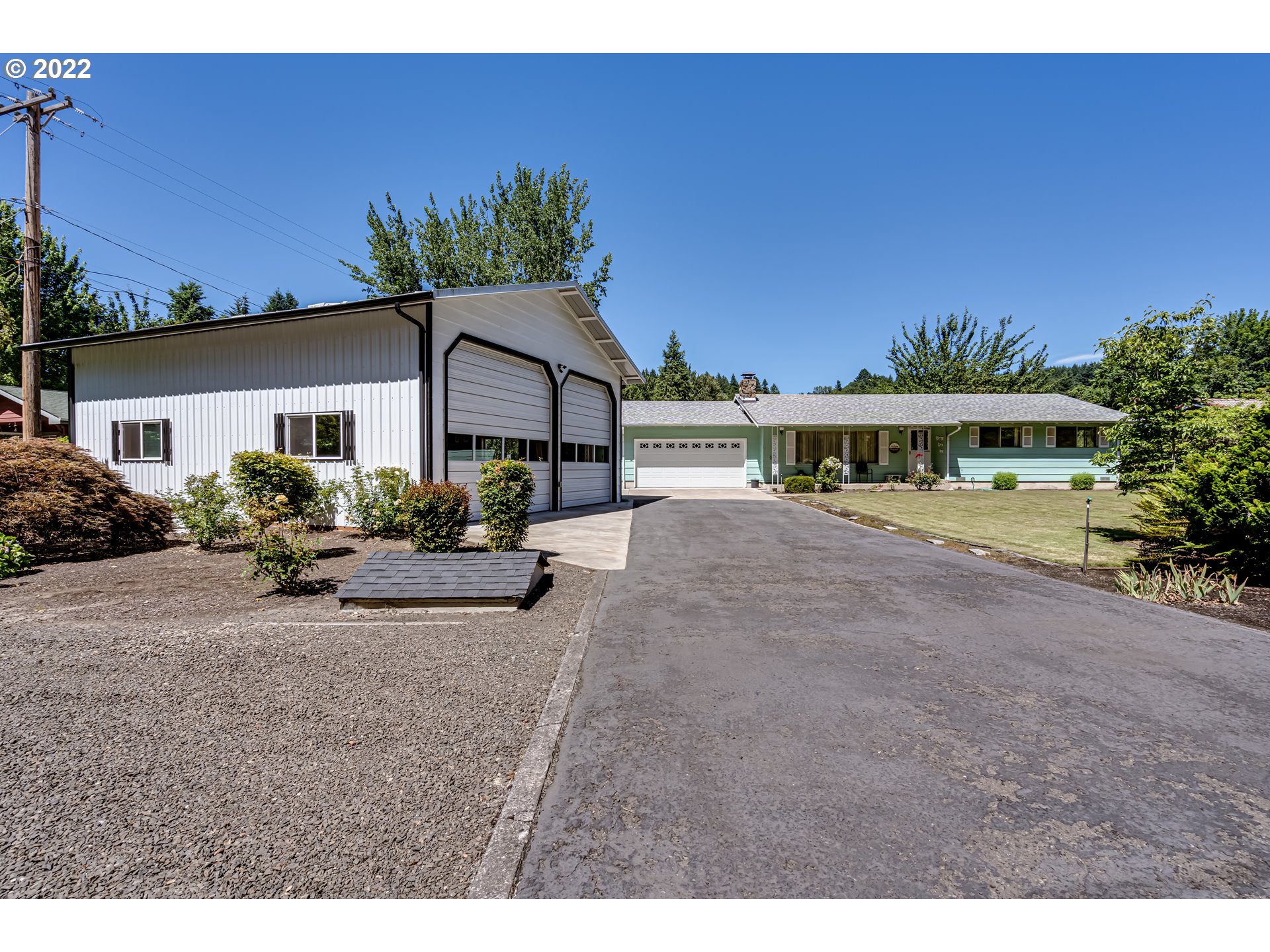 37833 Camp Creek Road Springfield, OR 97478 - Photo 2 of 32 a view of a house with a yard and potted plants