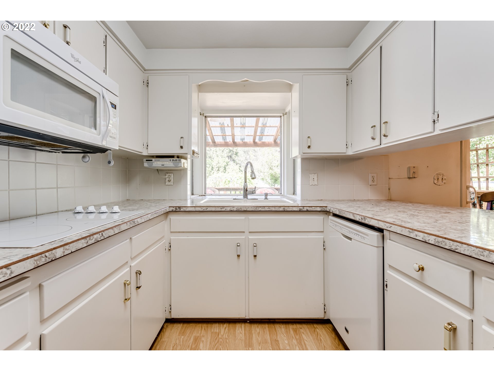 37833 Camp Creek Road Springfield, OR 97478 - Photo 6 of 32 a kitchen with cabinets appliances and a window