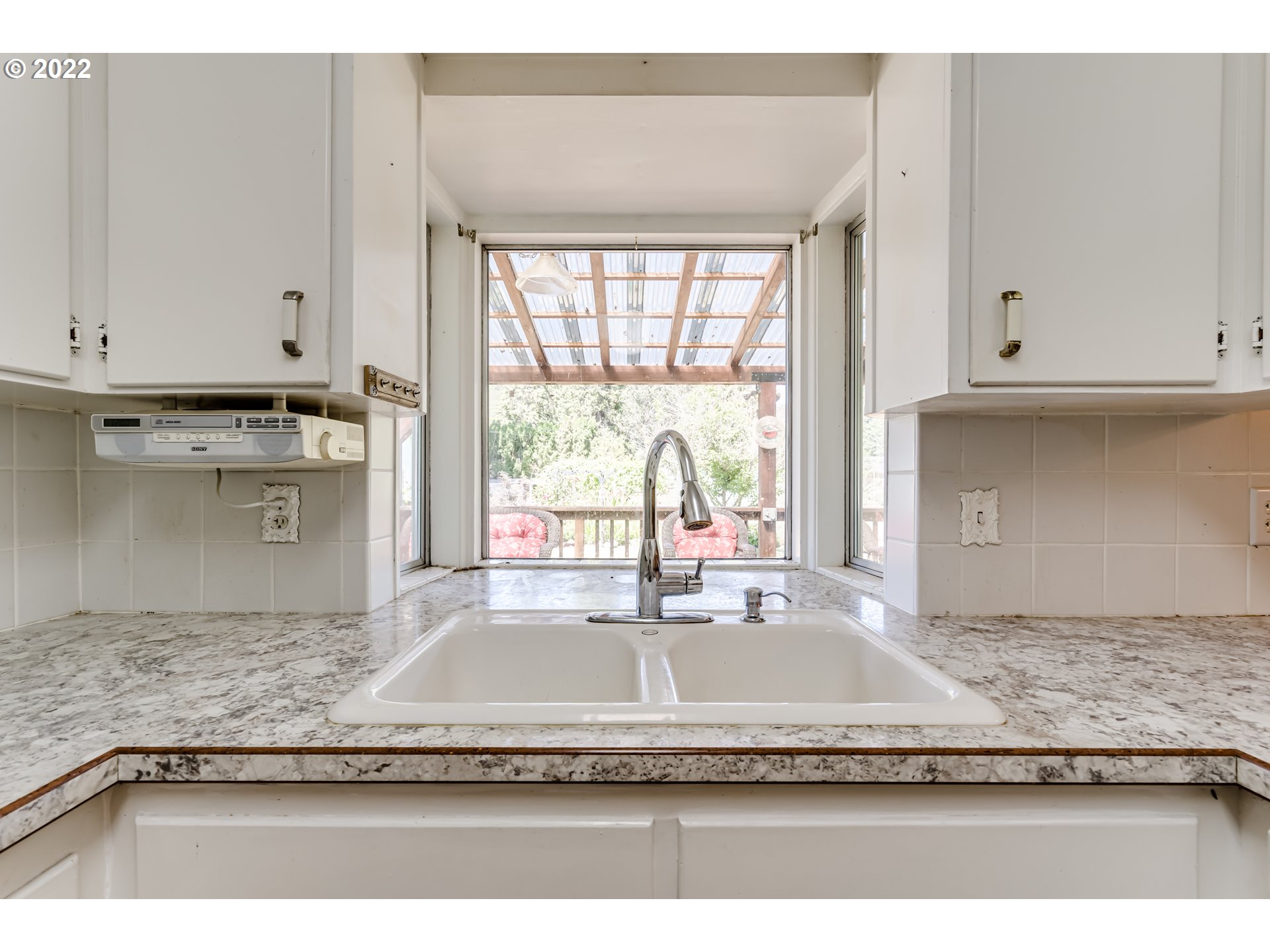 37833 Camp Creek Road Springfield, OR 97478 - Photo 7 of 32 a view of a kitchen with granite countertop a sink and a counter top space