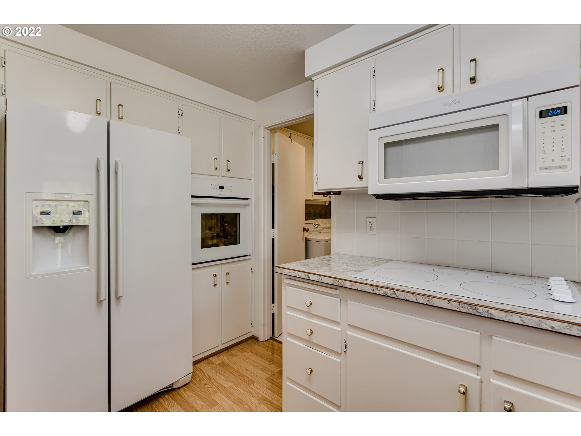 37833 Camp Creek Road Springfield, OR 97478 - Photo 8 of 32 a kitchen with stainless steel appliances white cabinets and a refrigerator