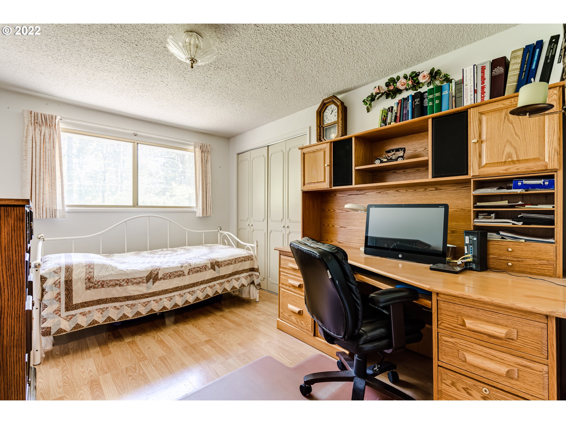 37833 Camp Creek Road Springfield, OR 97478 - Photo 9 of 32 a bedroom with a bed and a desk in it