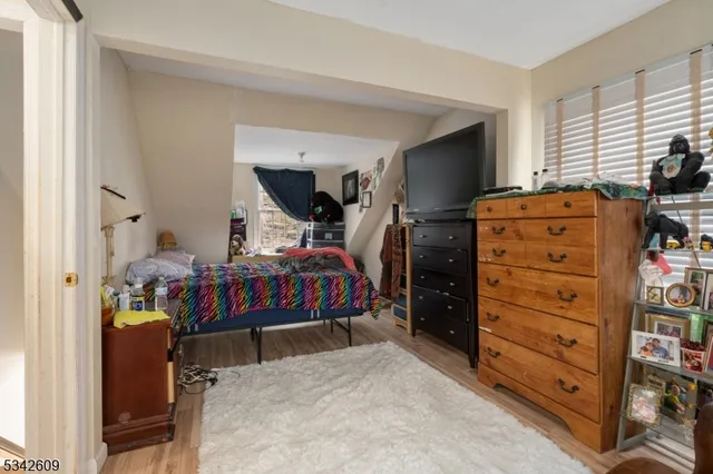 a bedroom with a bed and furniture