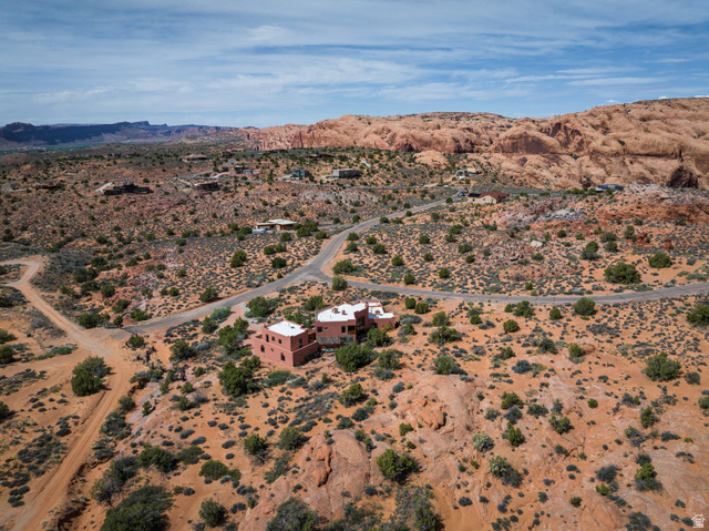 3617 Red Rock Drive Moab, UT 84532 - Photo 72 of 79 Aerial view of sparsely populated area featuring a desert landscape and a mountain backdrop