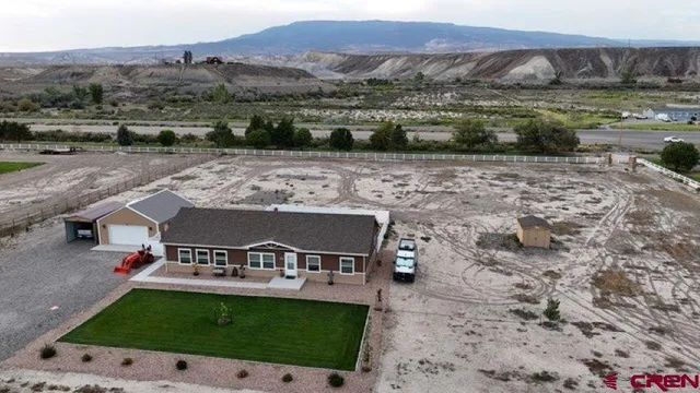 an aerial view of a kitchen with a fireplace basket ball court and wooden floor