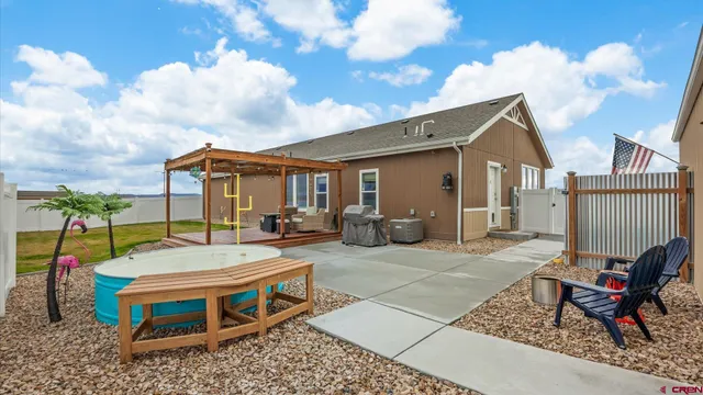 a spacious bedroom with a bed and a lamp