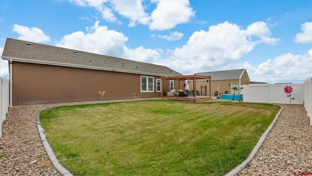 a spacious bathroom with a double vanity sink a large mirror and a shower