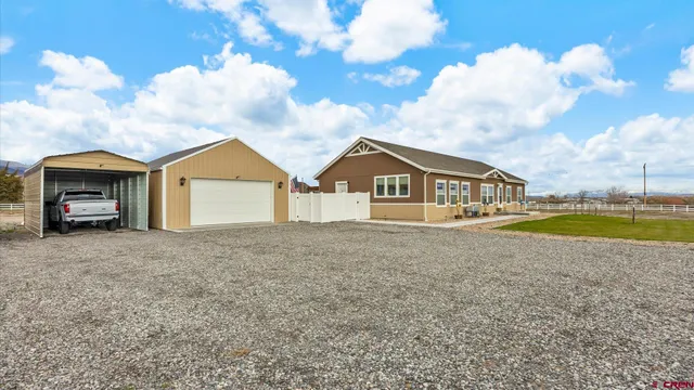a bathroom with a granite countertop sink a bathtub and a shower