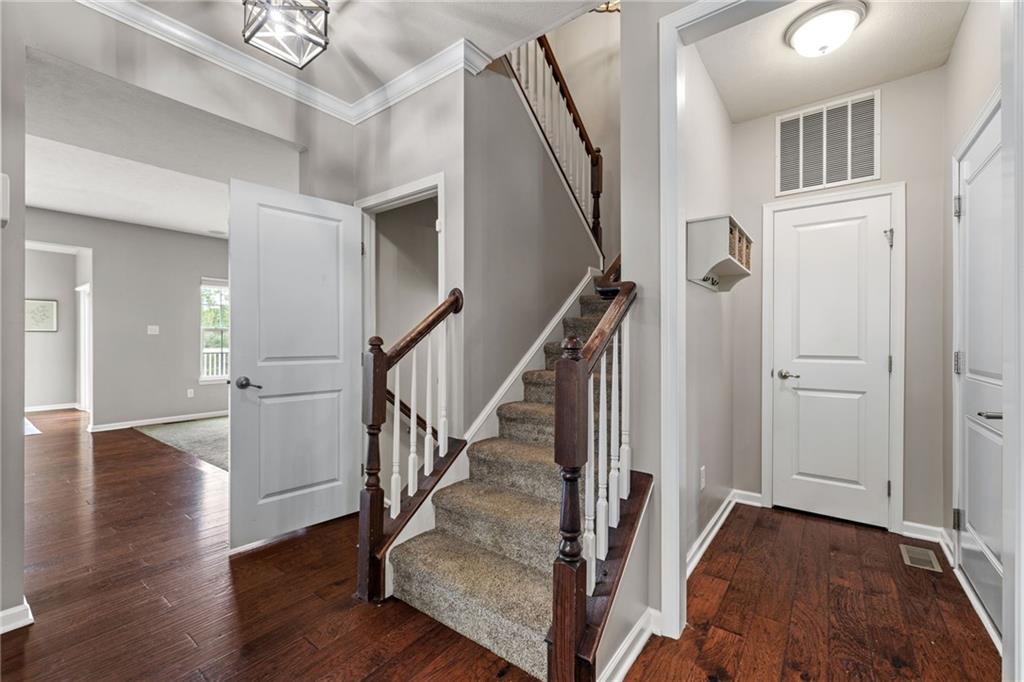 174 Cimarron Drive Coraopolis, PA 15108 - Photo 24 of 50 a view of entryway with wooden floor and stair