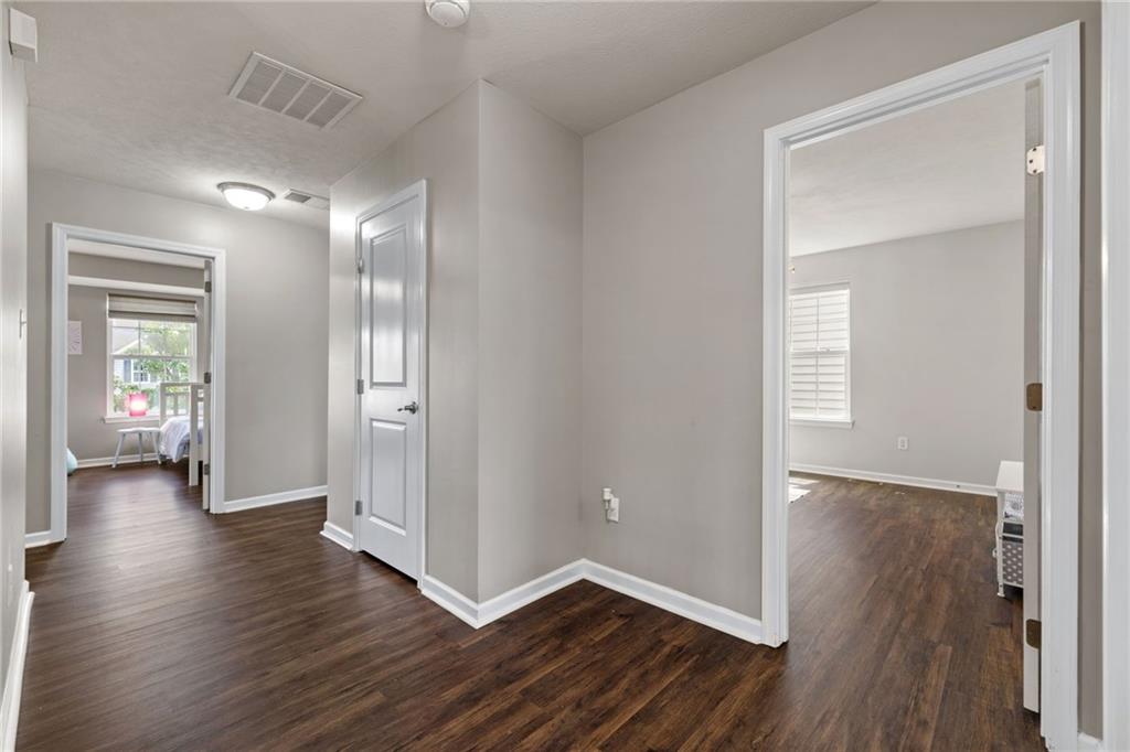 174 Cimarron Drive Coraopolis, PA 15108 - Photo 25 of 50 an empty room with wooden floor and a bathroom