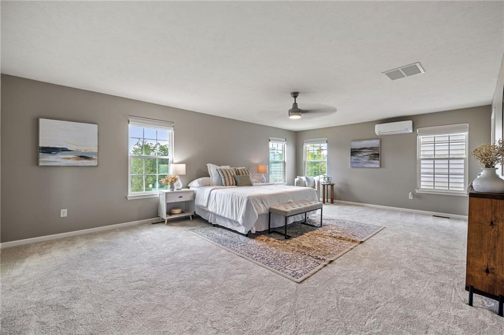 174 Cimarron Drive Coraopolis, PA 15108 - Photo 26 of 50 a spacious bedroom with a bed and a window