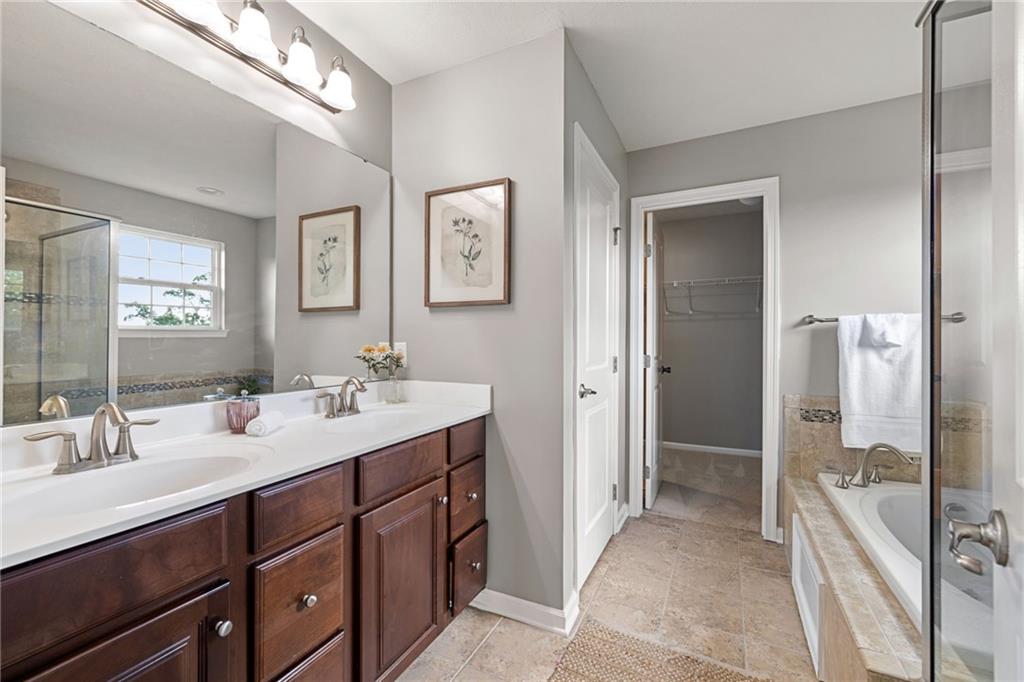 174 Cimarron Drive Coraopolis, PA 15108 - Photo 30 of 50 a spacious bathroom with a double vanity sink a mirror and shower