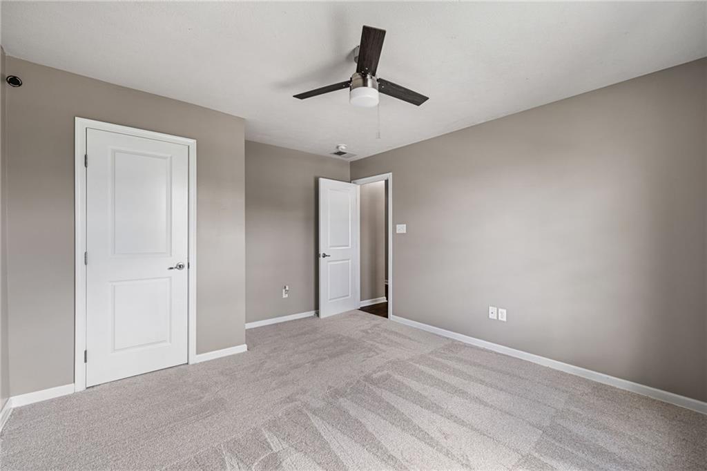 174 Cimarron Drive Coraopolis, PA 15108 - Photo 38 of 50 a view of an empty room and window and ceiling fan