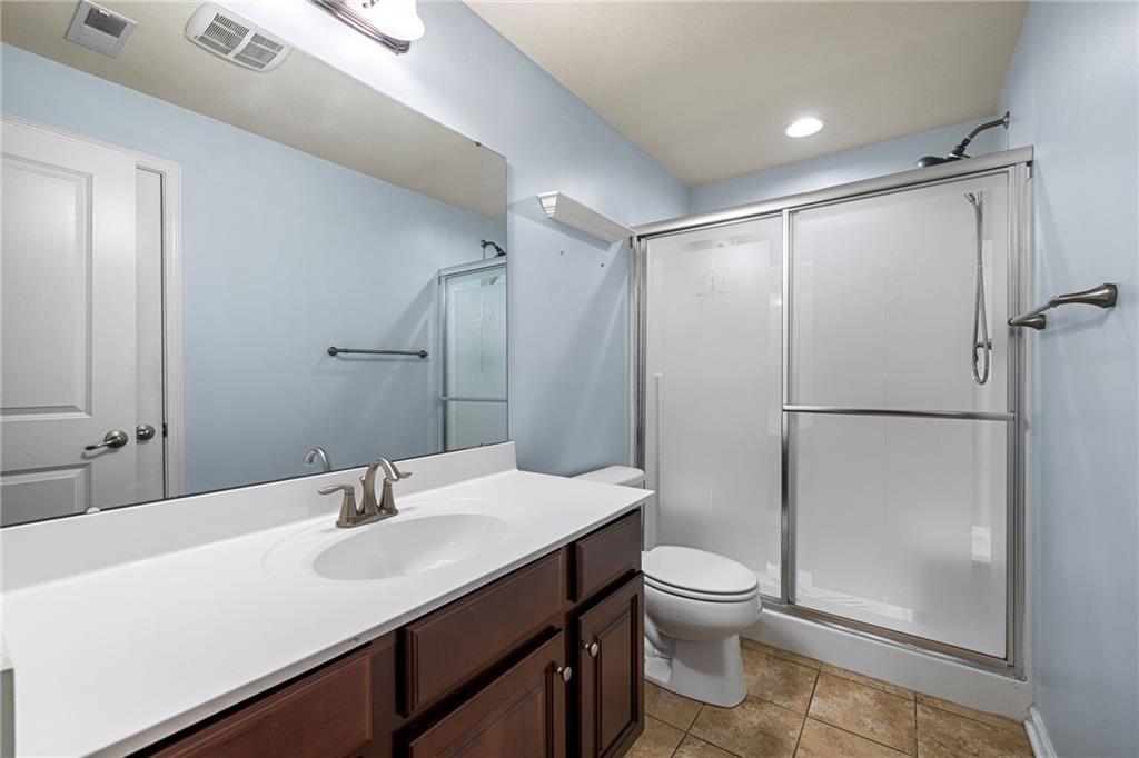 174 Cimarron Drive Coraopolis, PA 15108 - Photo 48 of 50 a bathroom with a double vanity sink toilet mirror and shower