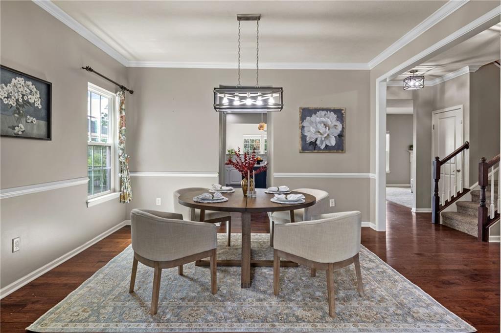 174 Cimarron Drive Coraopolis, PA 15108 - Photo 7 of 50 a view of a dining room with furniture wooden floor and a chandelier