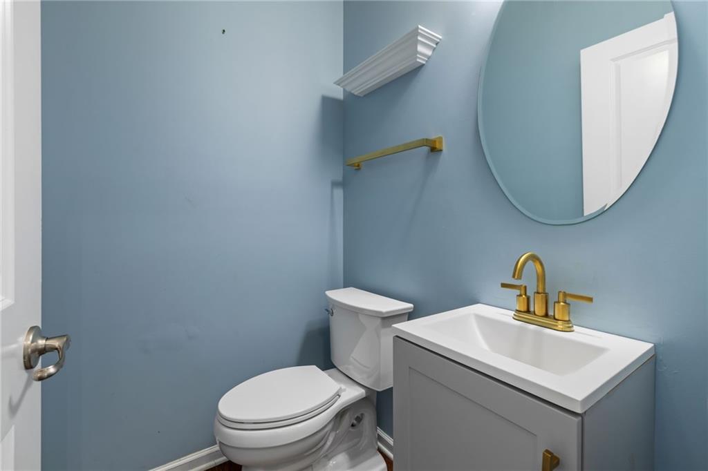 174 Cimarron Drive Coraopolis, PA 15108 - Photo 10 of 50 a bathroom with a toilet a sink and mirror