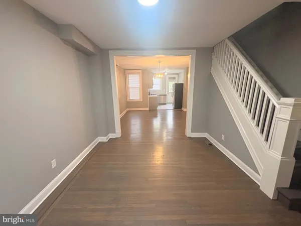 a view of an entryway with wooden floor