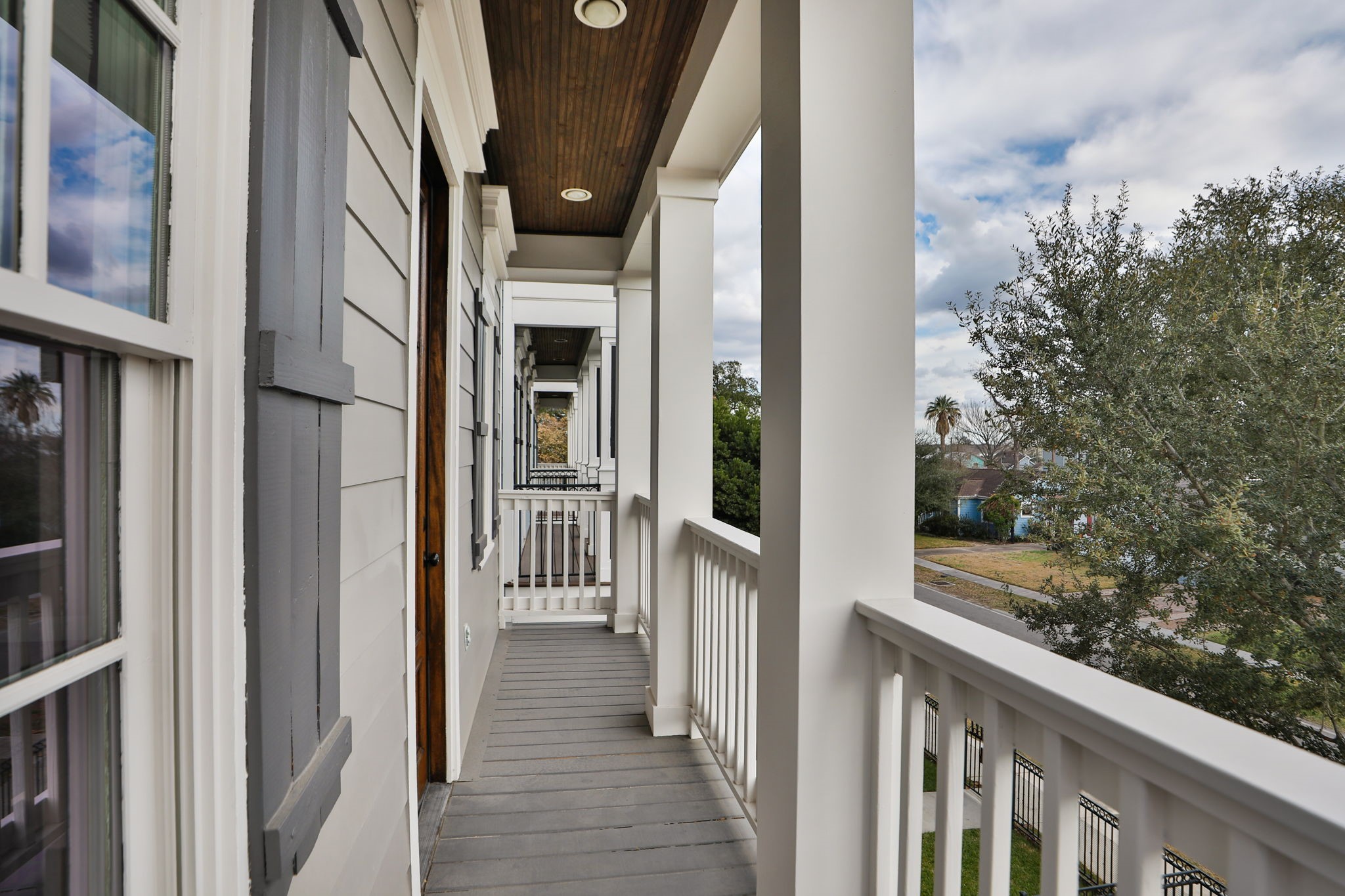 907 East 25th Street Houston, TX 77009 - Photo 15 of 32 Great view of double gallery porch upstairs off the primary bedroom.