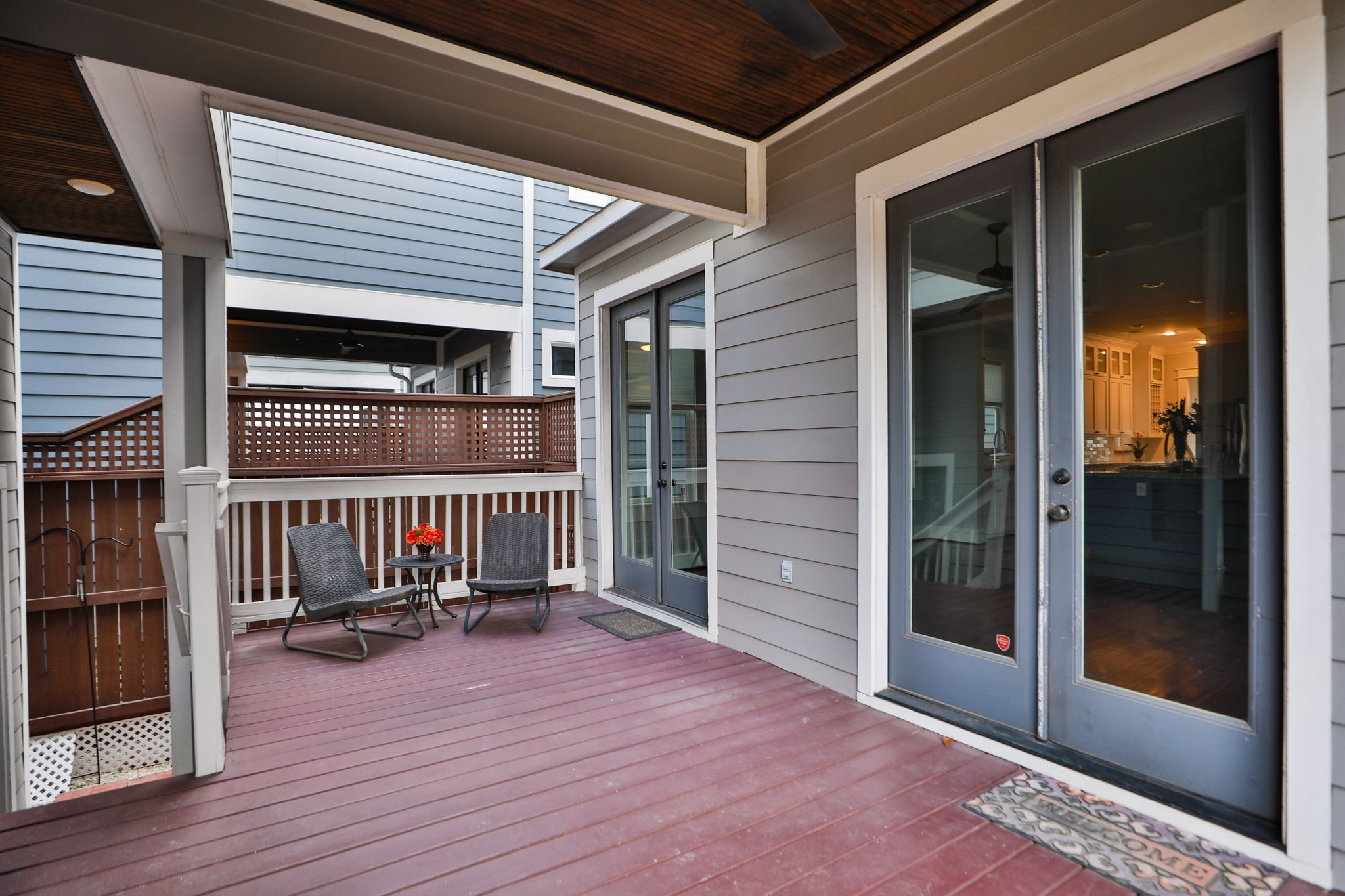 907 East 25th Street Houston, TX 77009 - Photo 27 of 32 Home has front and back covered porches perfect for socializing. These glass doors enter the family room.