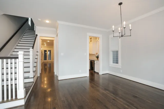 a view of wooden floor and windows in a room