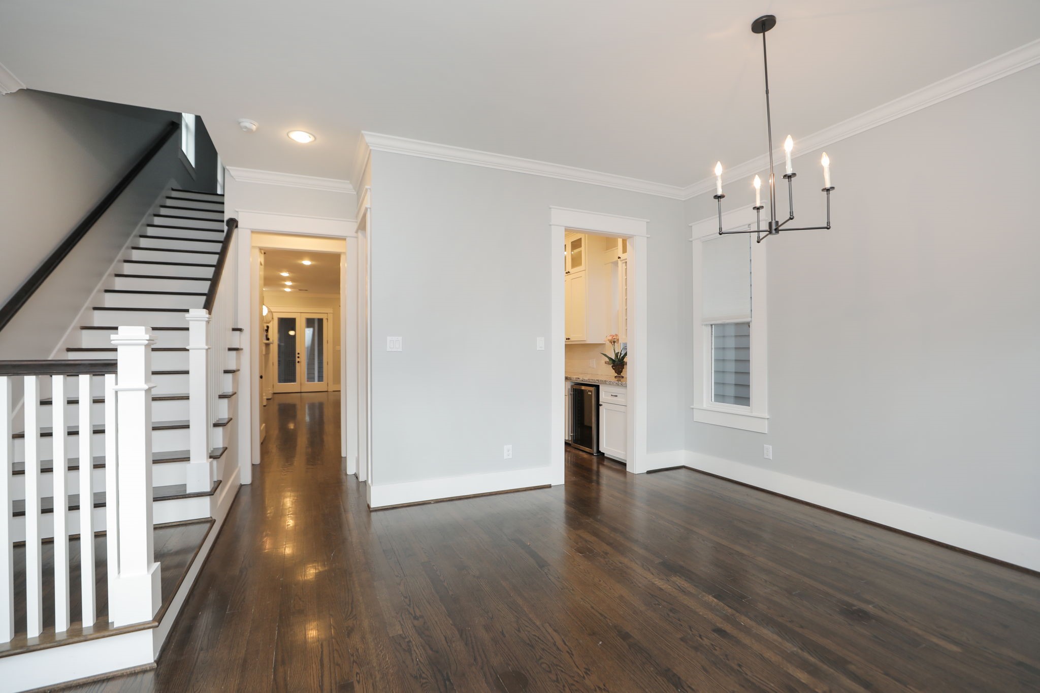 907 East 25th Street Houston, TX 77009 - Photo 4 of 32 Open concept design from spacious dining area to kitchen and family room. Also view of staircase that leads upstairs.