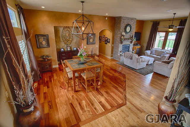 1140 23 Road Grand Junction, CO 81505 - Photo 4 of 13 a view of a dining room with furniture window and wooden floor