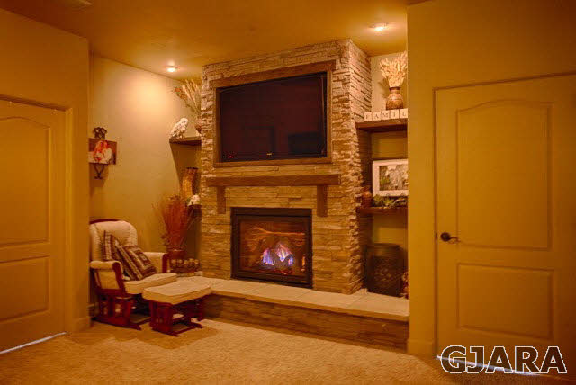 1140 23 Road Grand Junction, CO 81505 - Photo 5 of 13 a living room with furniture and a fireplace