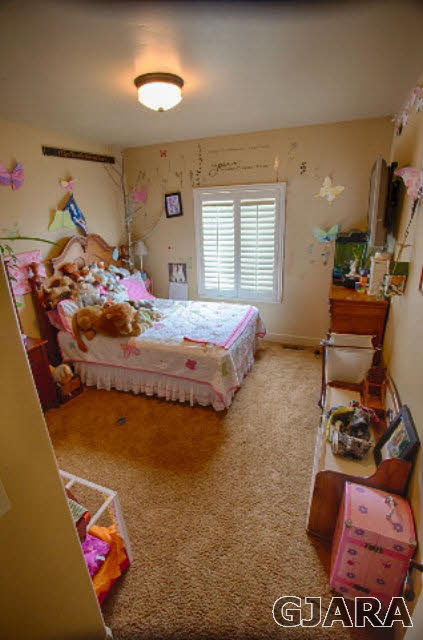 1140 23 Road Grand Junction, CO 81505 - Photo 6 of 13 a bedroom with bed and a window