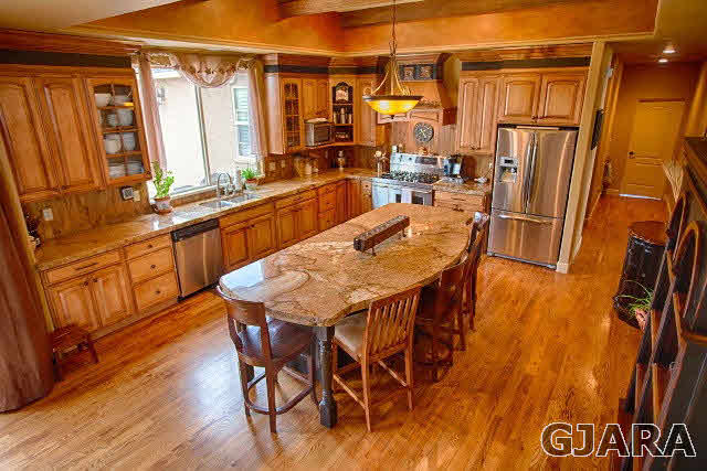 1140 23 Road Grand Junction, CO 81505 - Photo 8 of 13 a dining table with chairs and wooden floor