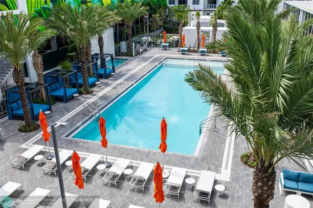 a view of a swimming pool with a patio