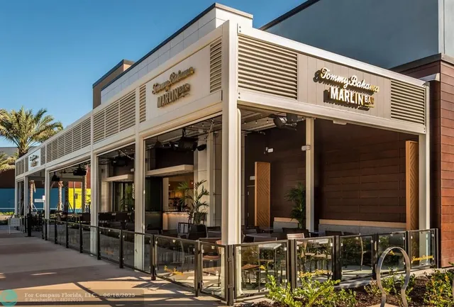 a front view of a building with a garden