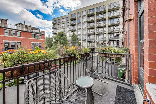 a view of a balcony with chairs
