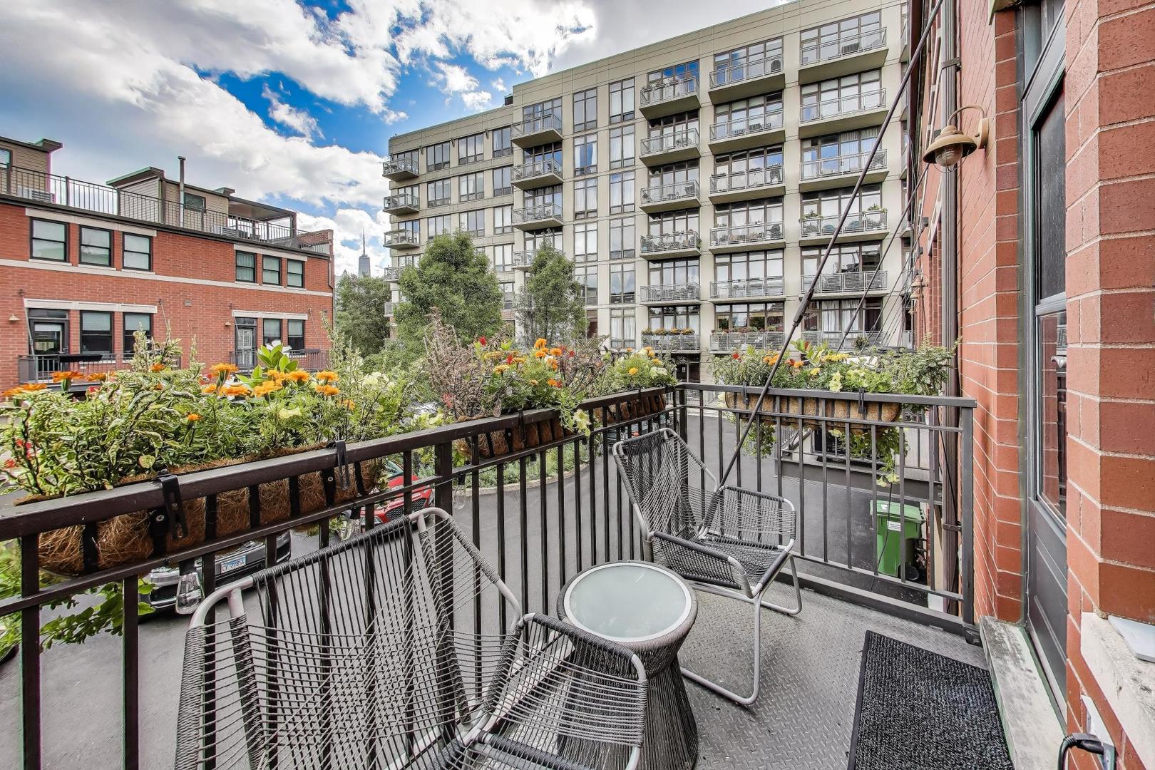 1009 North Riverwalk Street Chicago, IL 60610 - Photo 14 of 39 a view of a balcony with chairs