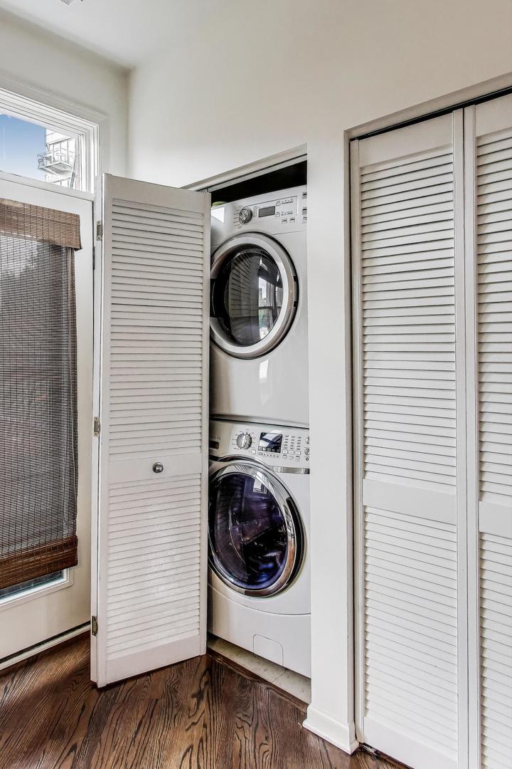1009 North Riverwalk Street Chicago, IL 60610 - Photo 18 of 39 a utility room with wooden floor washer and dryer
