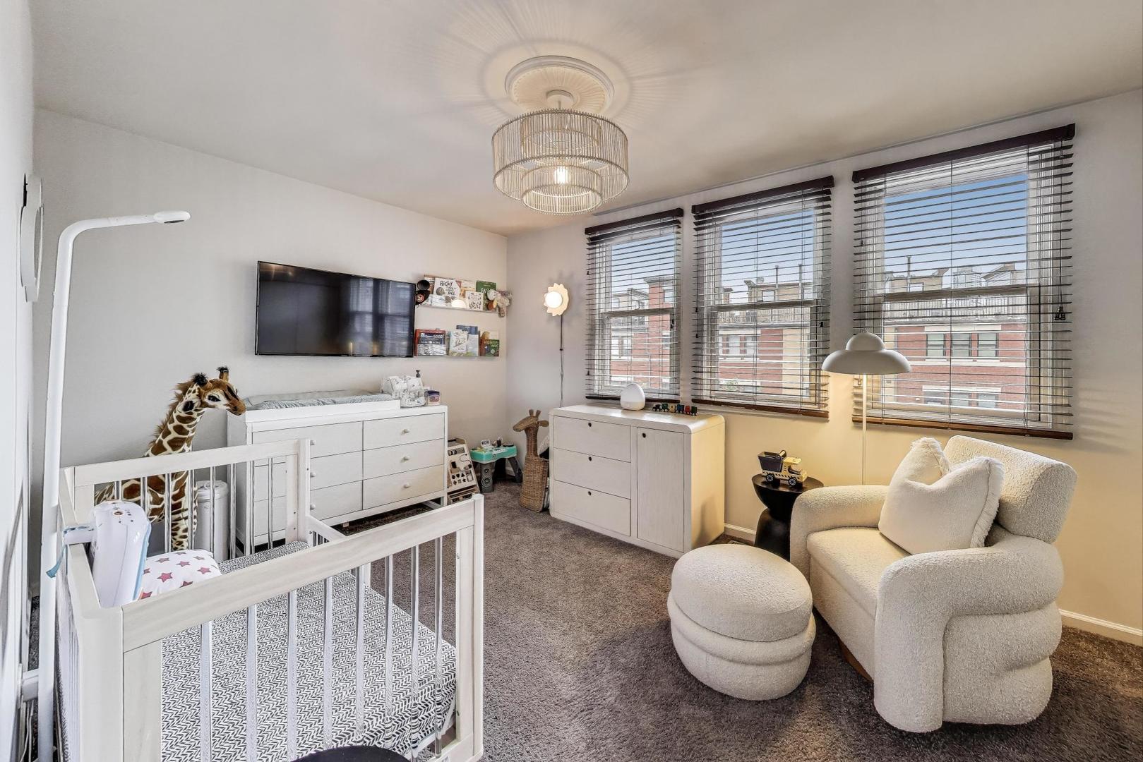 1009 North Riverwalk Street Chicago, IL 60610 - Photo 23 of 39 a living room with furniture and a flat screen tv