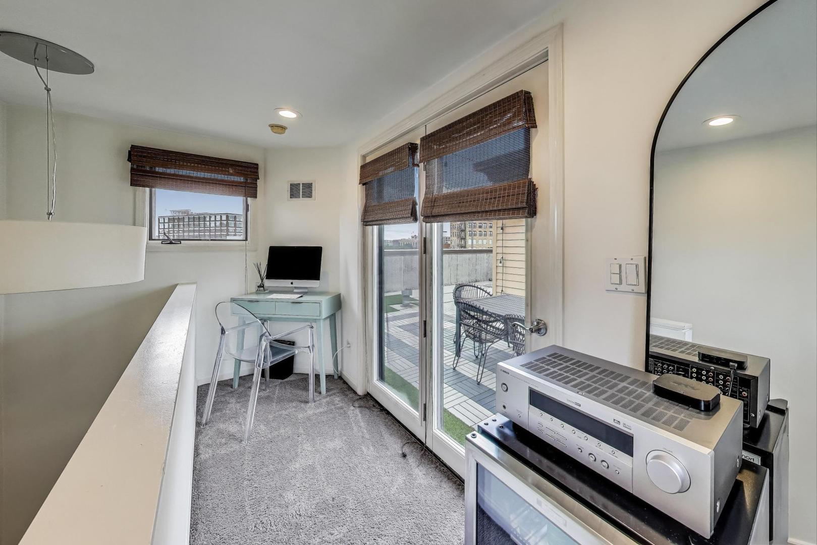 1009 North Riverwalk Street Chicago, IL 60610 - Photo 26 of 39 a living room with furniture and a flat screen tv