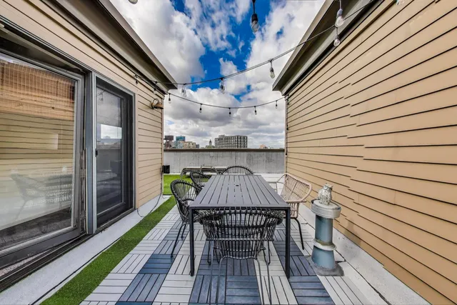 a view of a chairs and table in patio