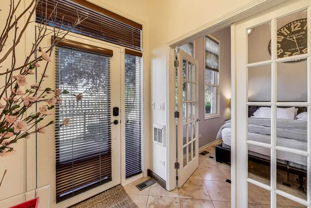 a bedroom with a large bed and a window