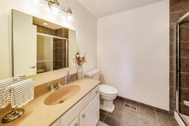 a bathroom with a glass shower door
