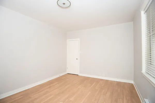 a view of an empty room and window